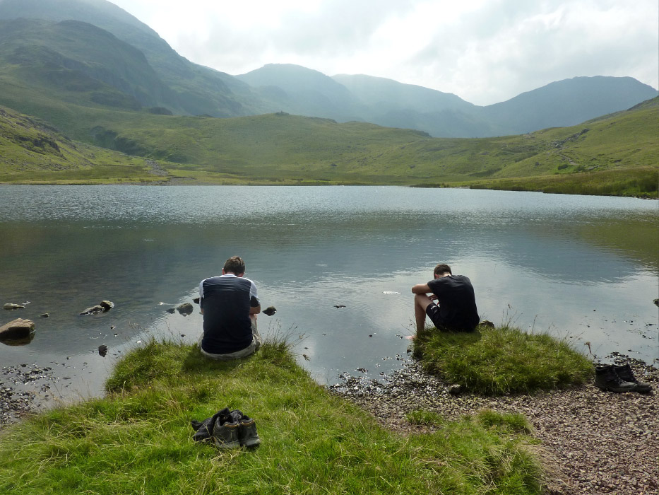 Cooling off the feet in Sty Head Tarn