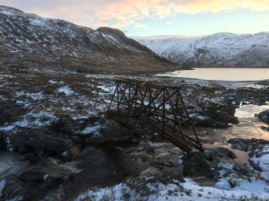 The bridge over the Alder Burn leading to the bothy, with Loch Ericht in the background